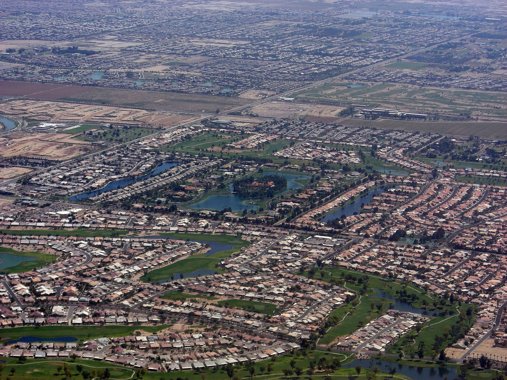 Aerial view of Chandler, Arizona showing master-planned neighborhoods and lakes in the Maricopa County desert