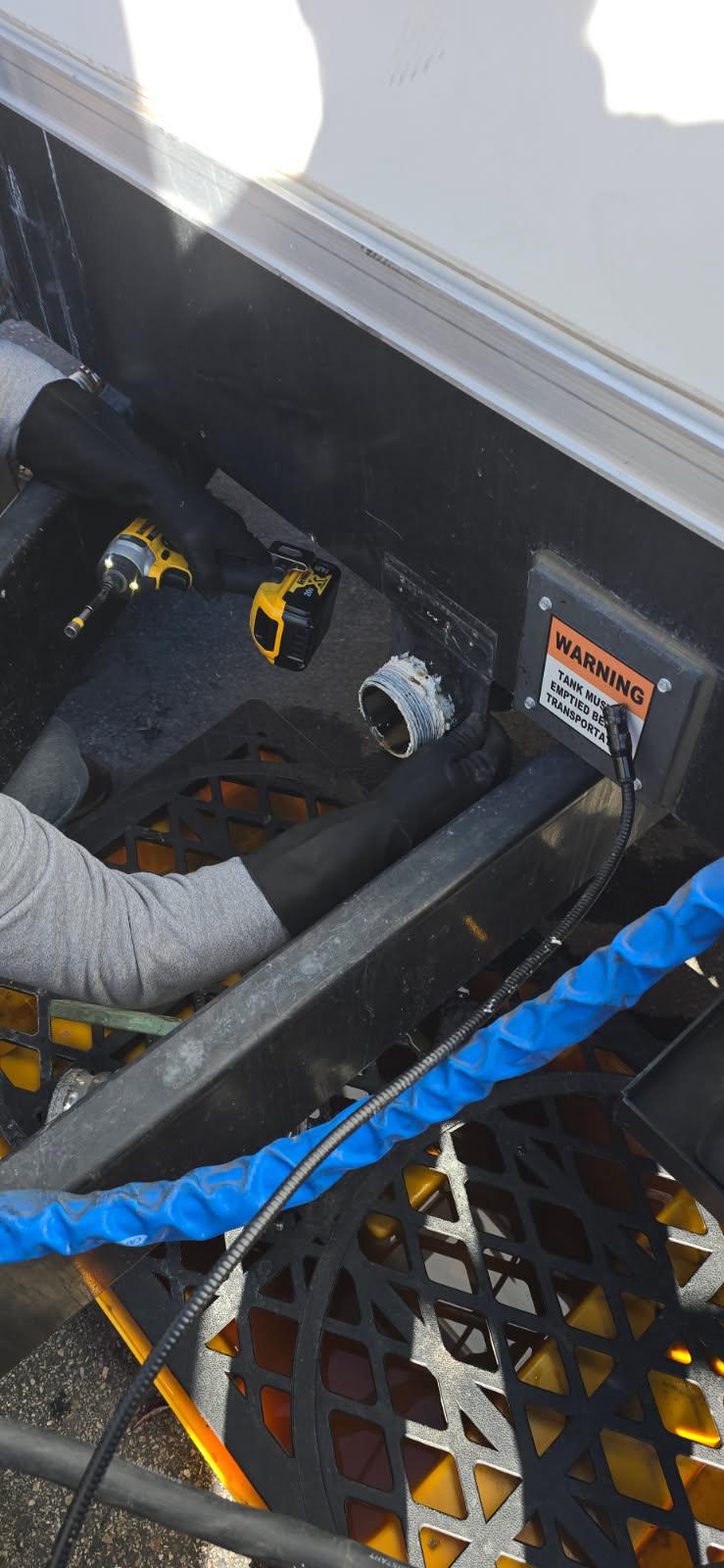 Close view of a KryoFridge trailer's refrigeration unit and power connection, which runs on a dedicated circuit or generator