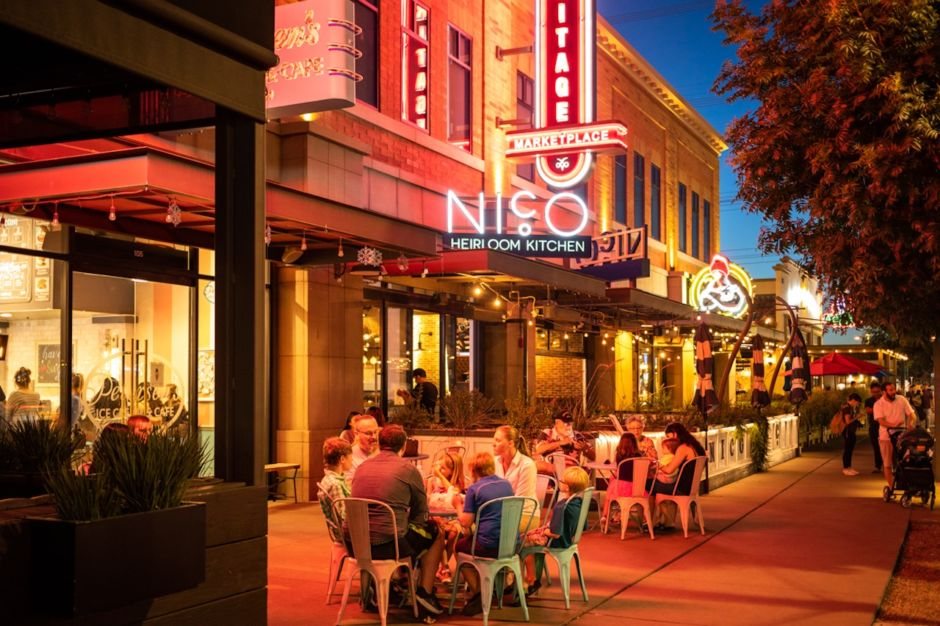 A packed downtown Gilbert restaurant patio at dusk in the Heritage District, the kind of dining and event scene that needs reliable cold storage