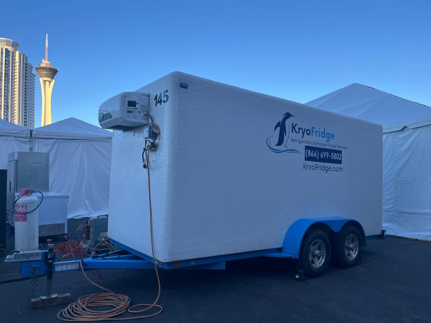KryoFridge branded trailer lit at dusk during an event deployment