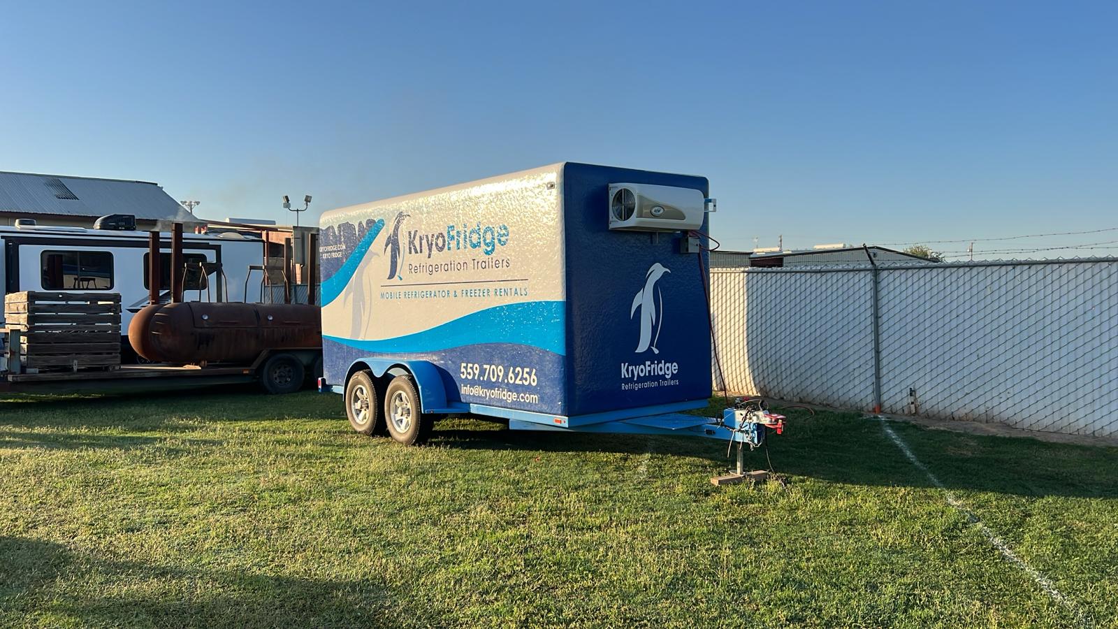 KryoFridge refrigerated trailer parked on an open field providing temporary freezer space for an outdoor operation