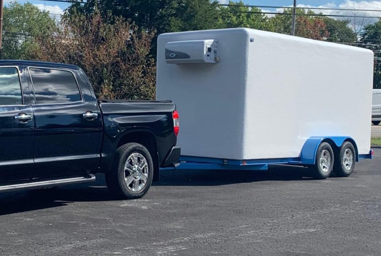 KryoFridge freezer trailer in transit on the highway heading to a same day refrigerated trailer rental delivery