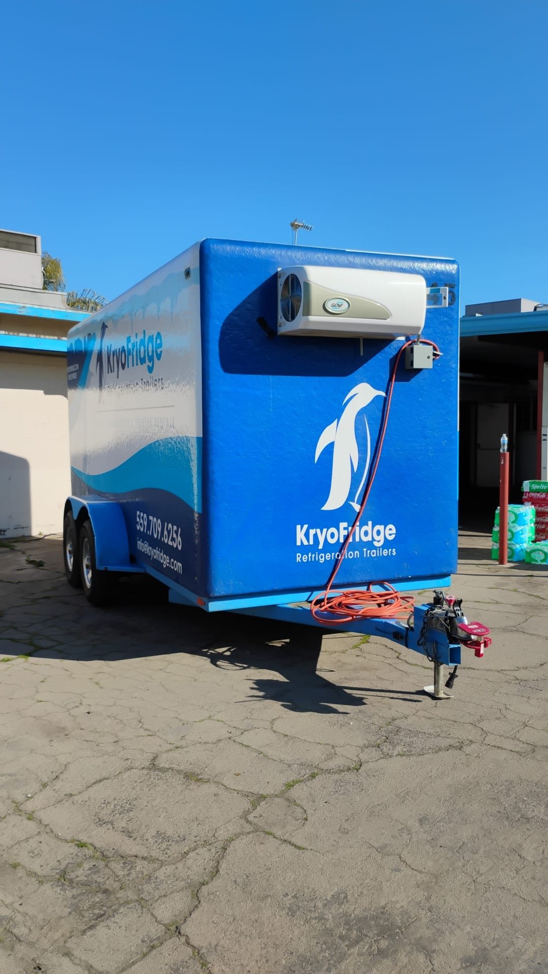 KryoFridge blue-and-white freezer trailer in side profile, staged for a same-day cold-storage delivery in Phoenix, Arizona