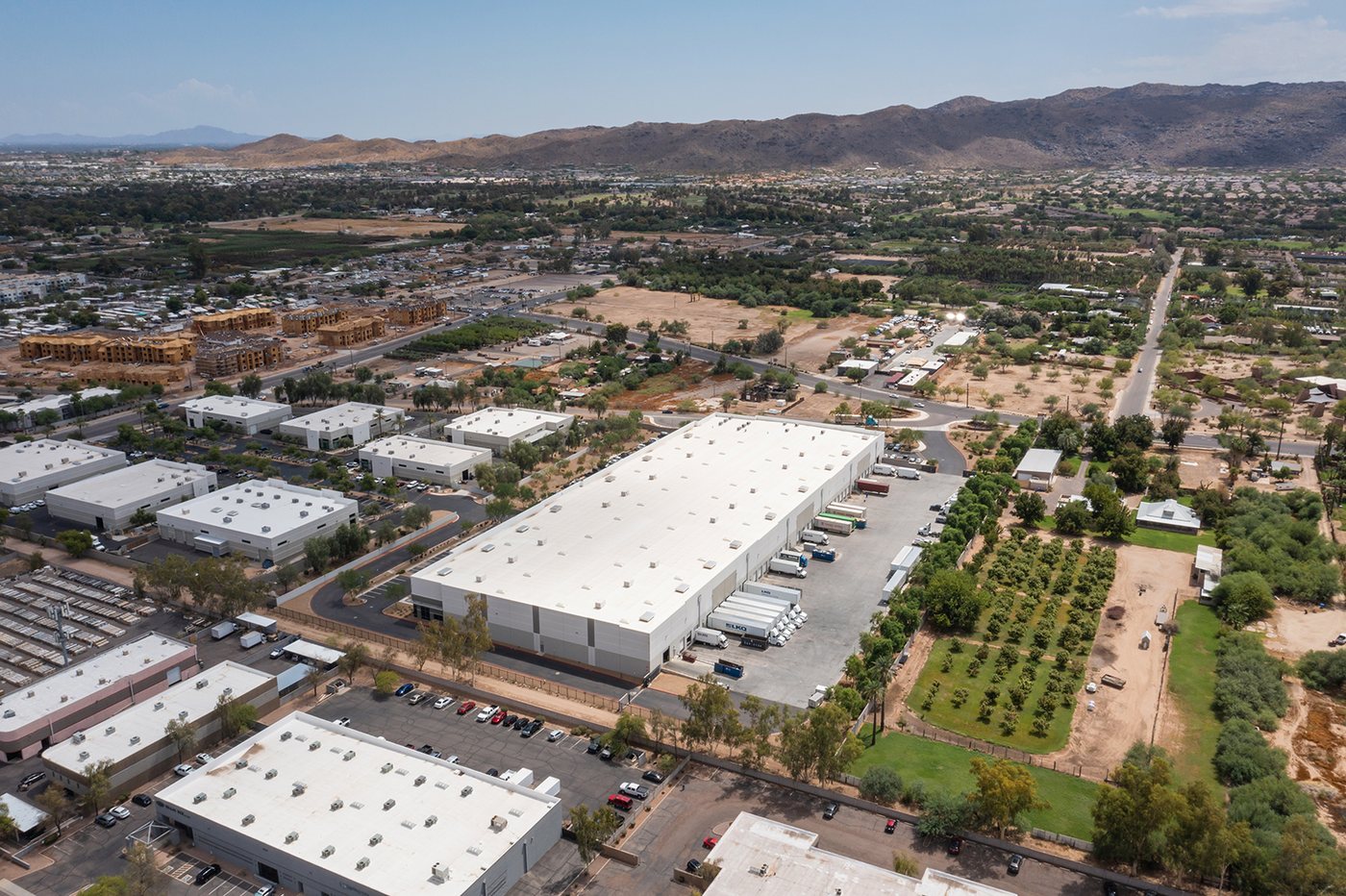 Aerial of a Phoenix industrial warehouse district near the freeway, the heart of the Valley's distribution boom