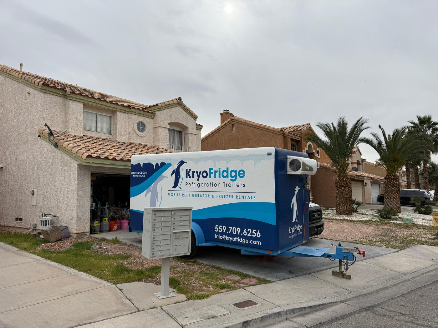 KryoFridge branded freezer trailer staged on-site providing backup cold storage for a commercial location