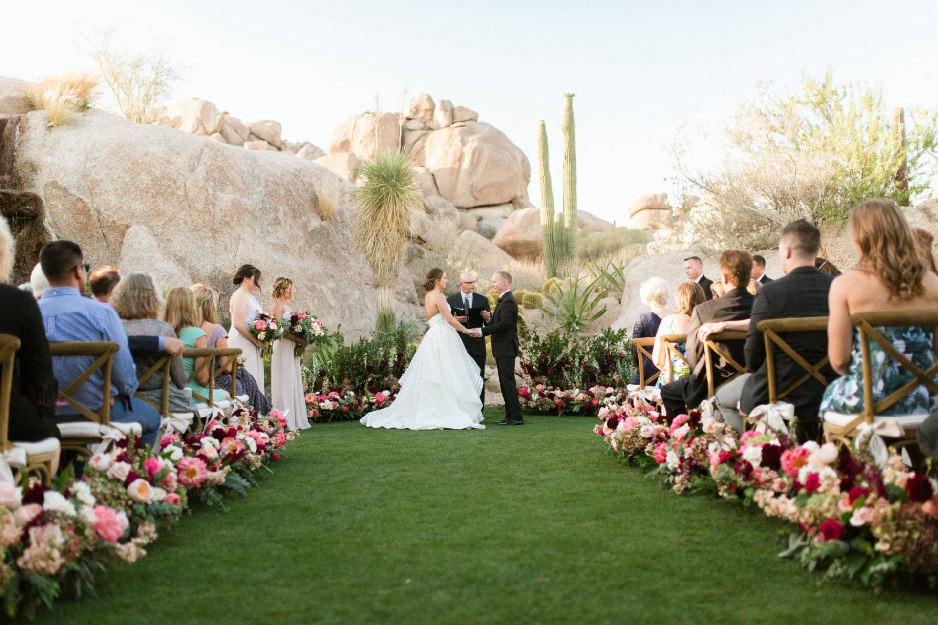 Outdoor desert wedding ceremony at a Scottsdale resort with florals and cacti, the kind of event that needs on-site refrigeration