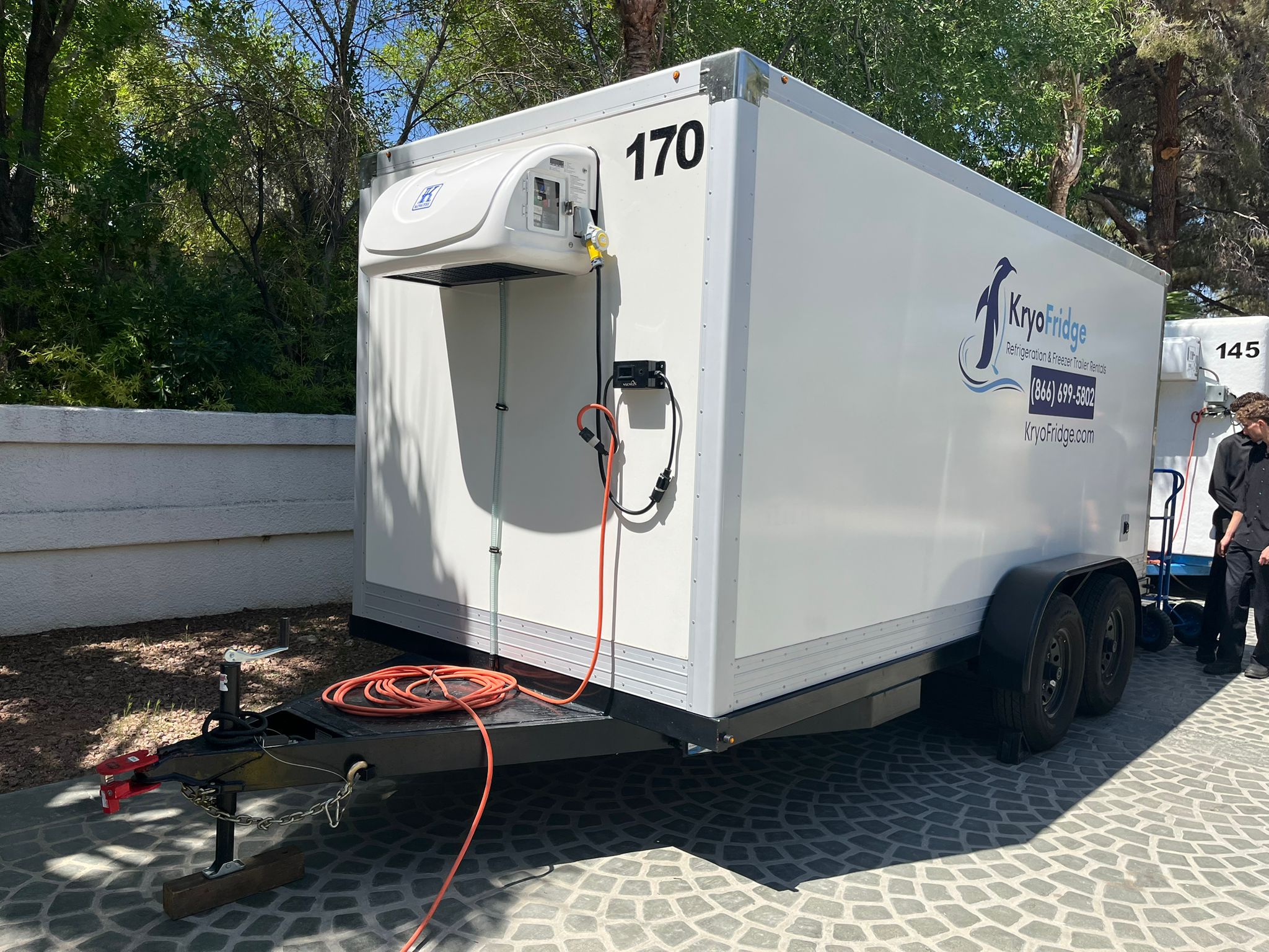 KryoFridge-branded refrigerated trailer with its reefer unit and power hookup, staged for a Scottsdale cold-storage job