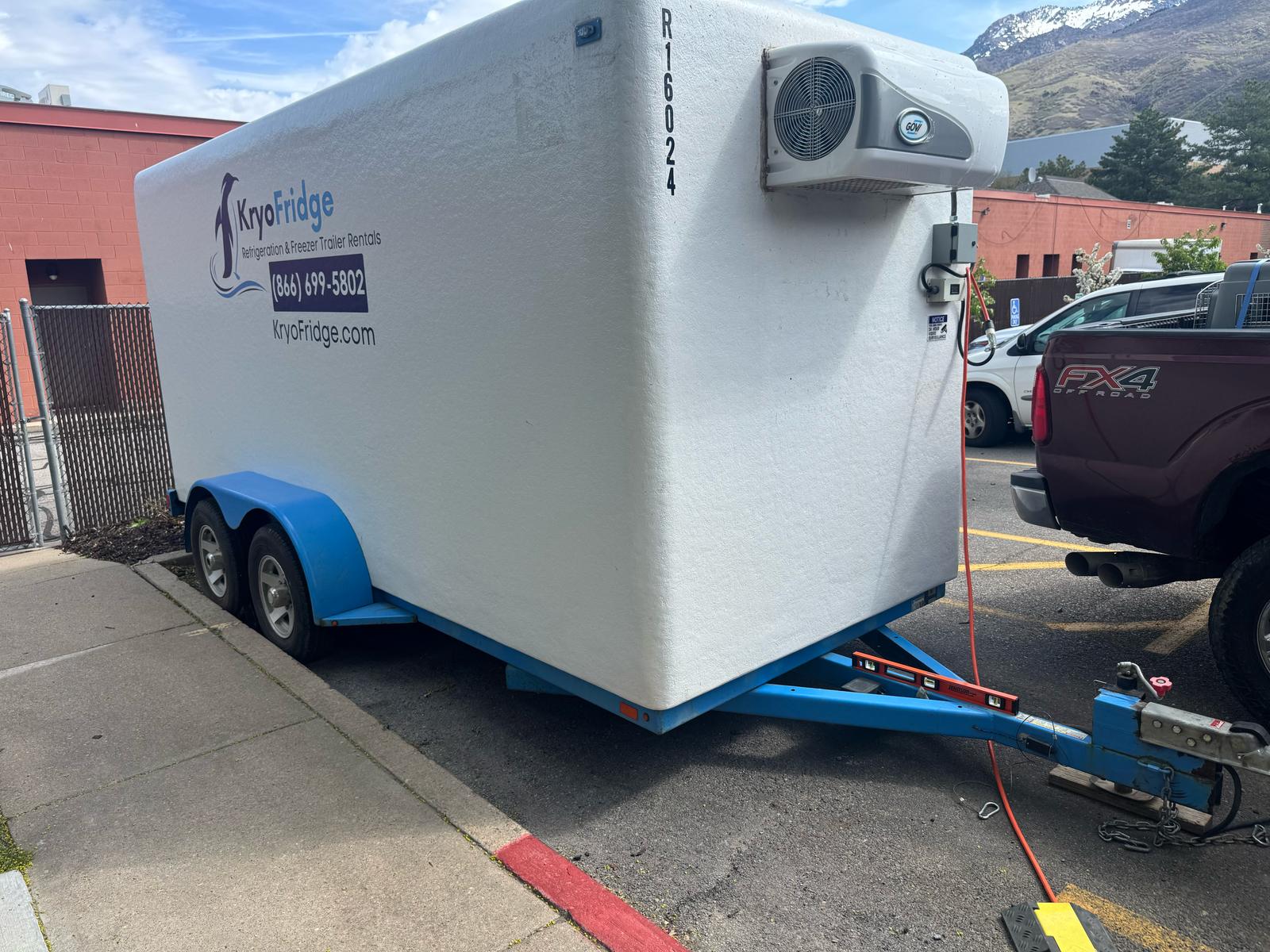 KryoFridge freezer trailer side view with the reefer unit running, staged for a Southern Arizona delivery