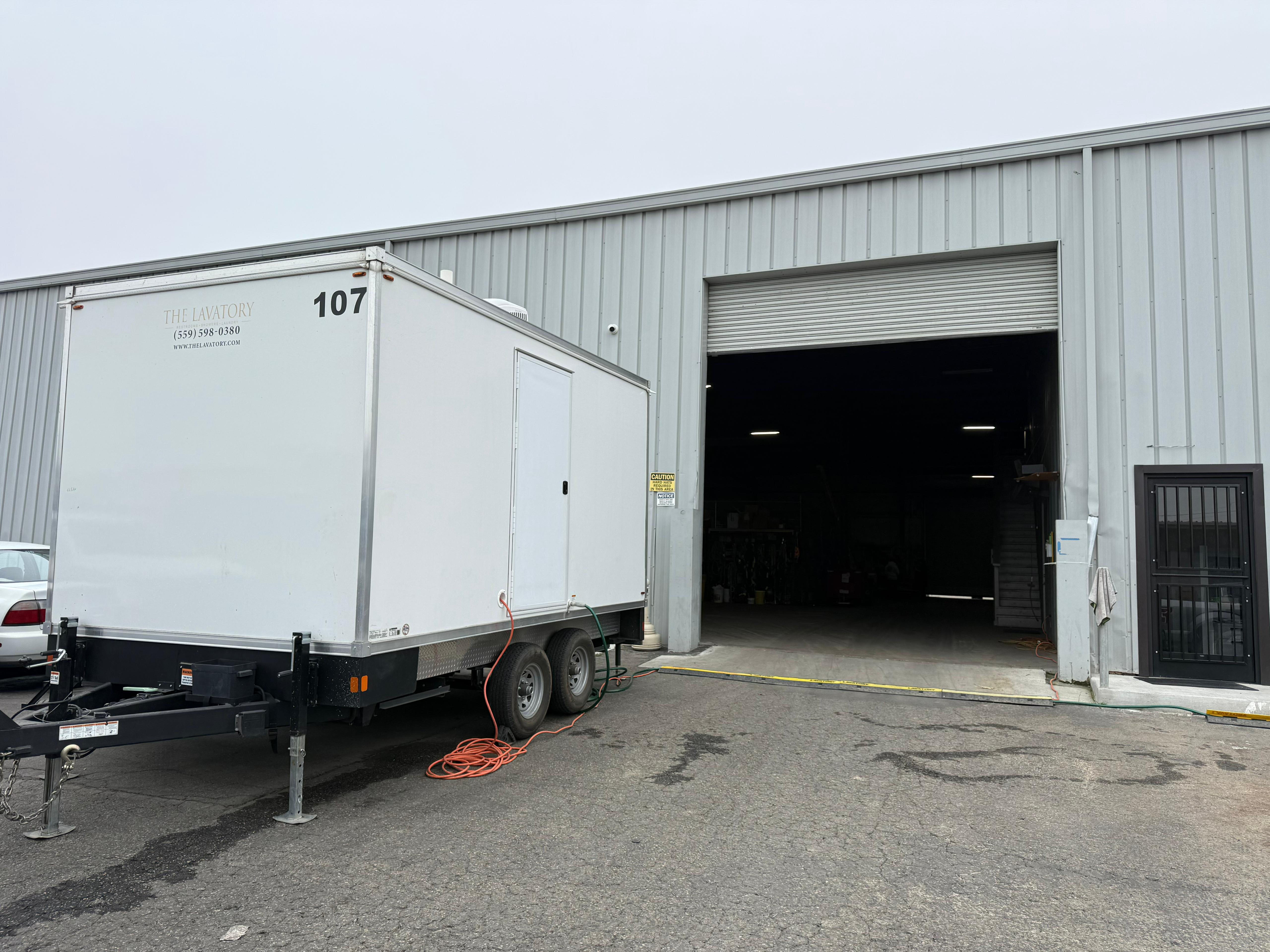 KryoFridge freezer trailer being maneuvered into a warehouse dock for a cold-storage delivery