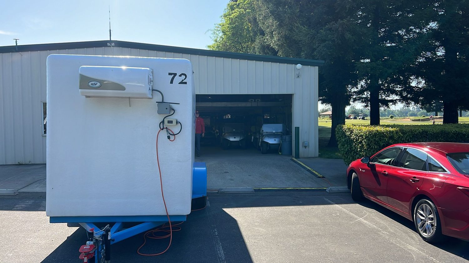 KryoFridge reefer trailer plugged into power with its refrigeration condenser running