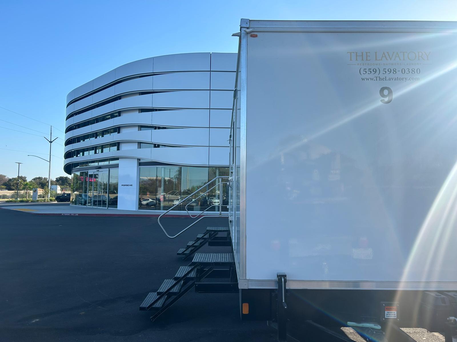 White KryoFridge refrigerated trailer staged on asphalt at a commercial property
