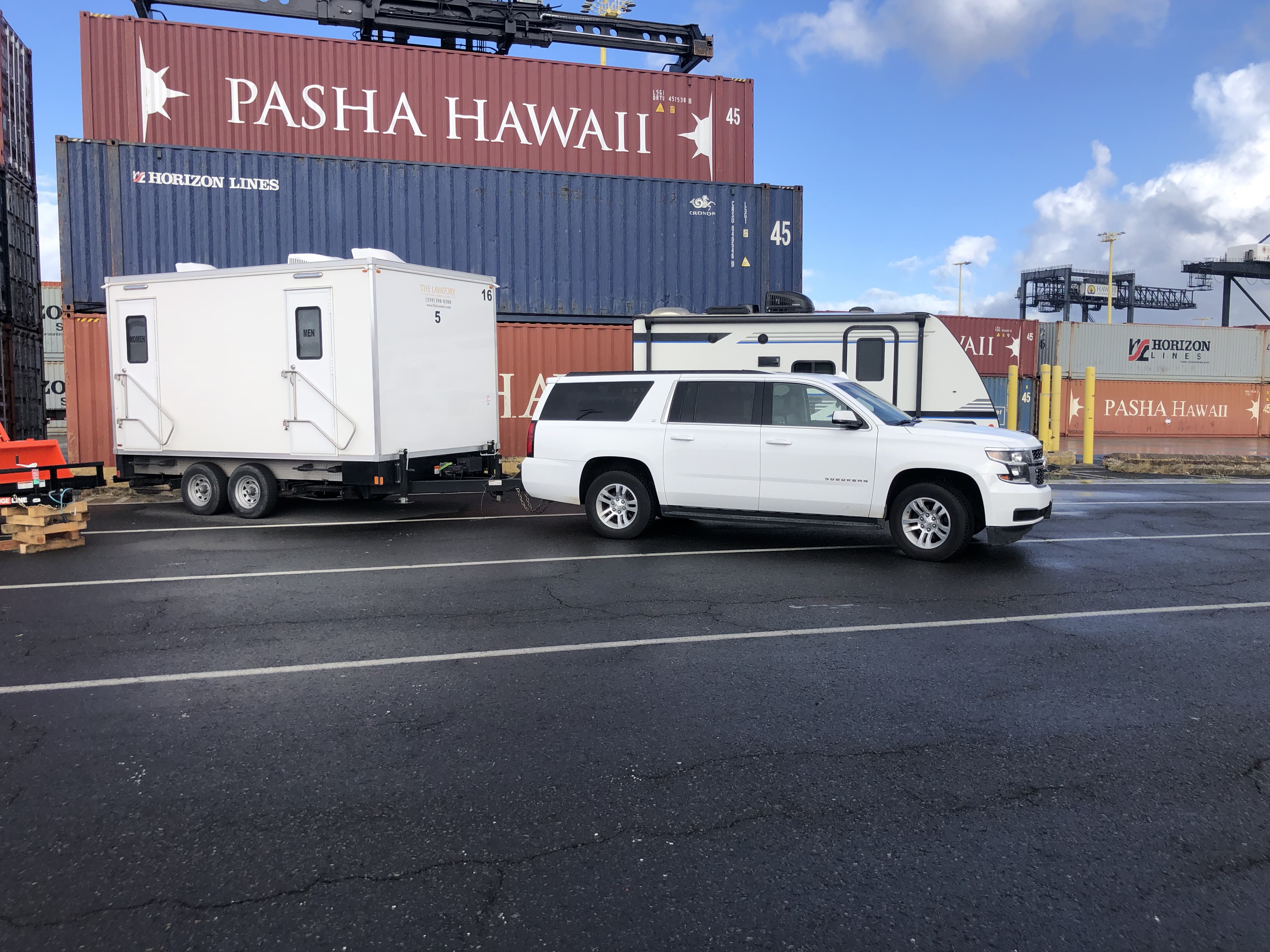 KryoFridge freezer trailer being towed for delivery across Orange County