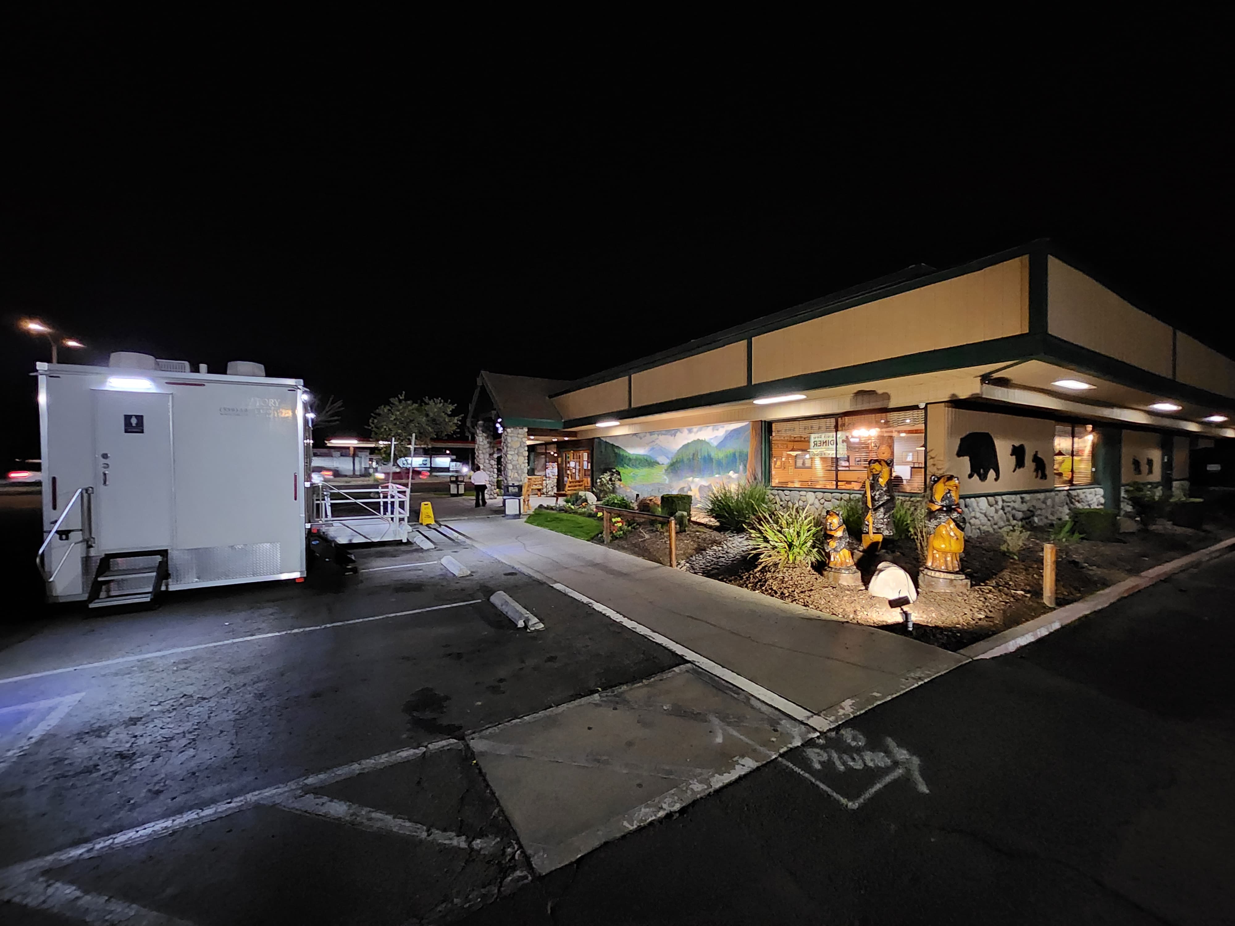 KryoFridge trailer staged at night outside a lit grocery storefront during a cold-storage outage