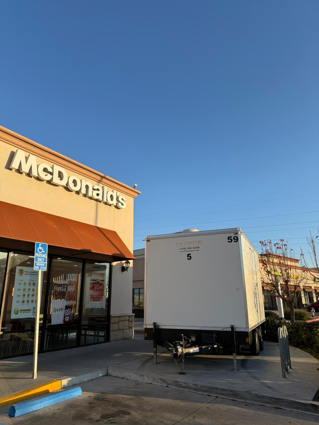 KryoFridge freezer trailer rental staged outside a McDonald's restaurant during a walk-in cooler repair