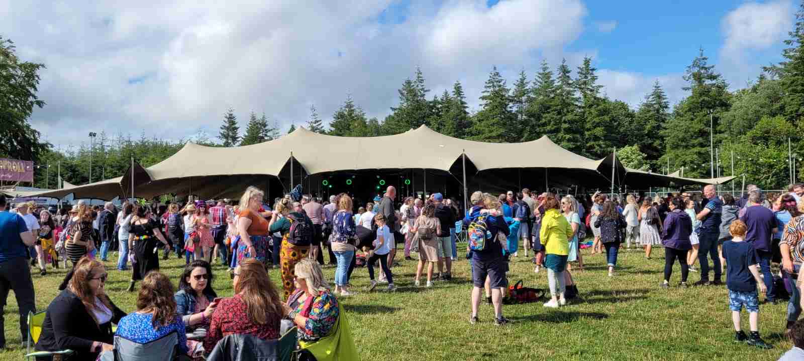 Outdoor Inland Empire festival with vendor tents that rely on on-site freezer trailer rentals