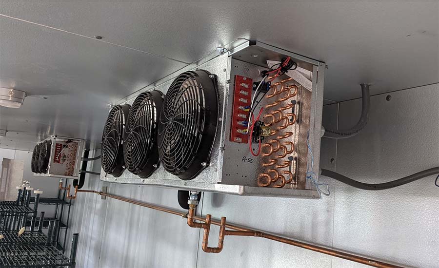 Frosted walk-in cooler evaporator coil, the failure that strands Inland Empire inventory in summer heat
