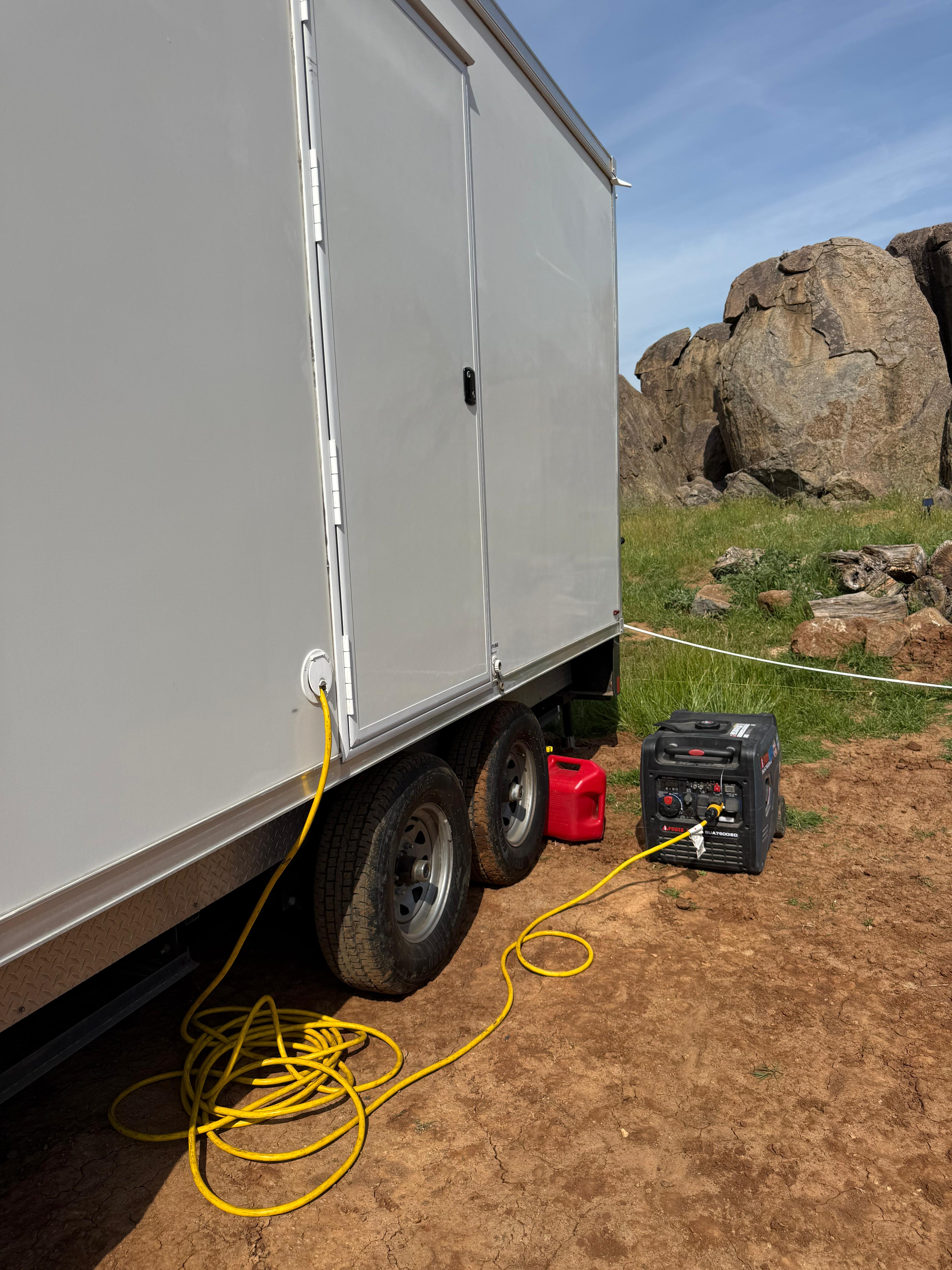 KryoFridge refrigerated trailer running on a portable generator on a jobsite, showing how the unit is powered off-grid