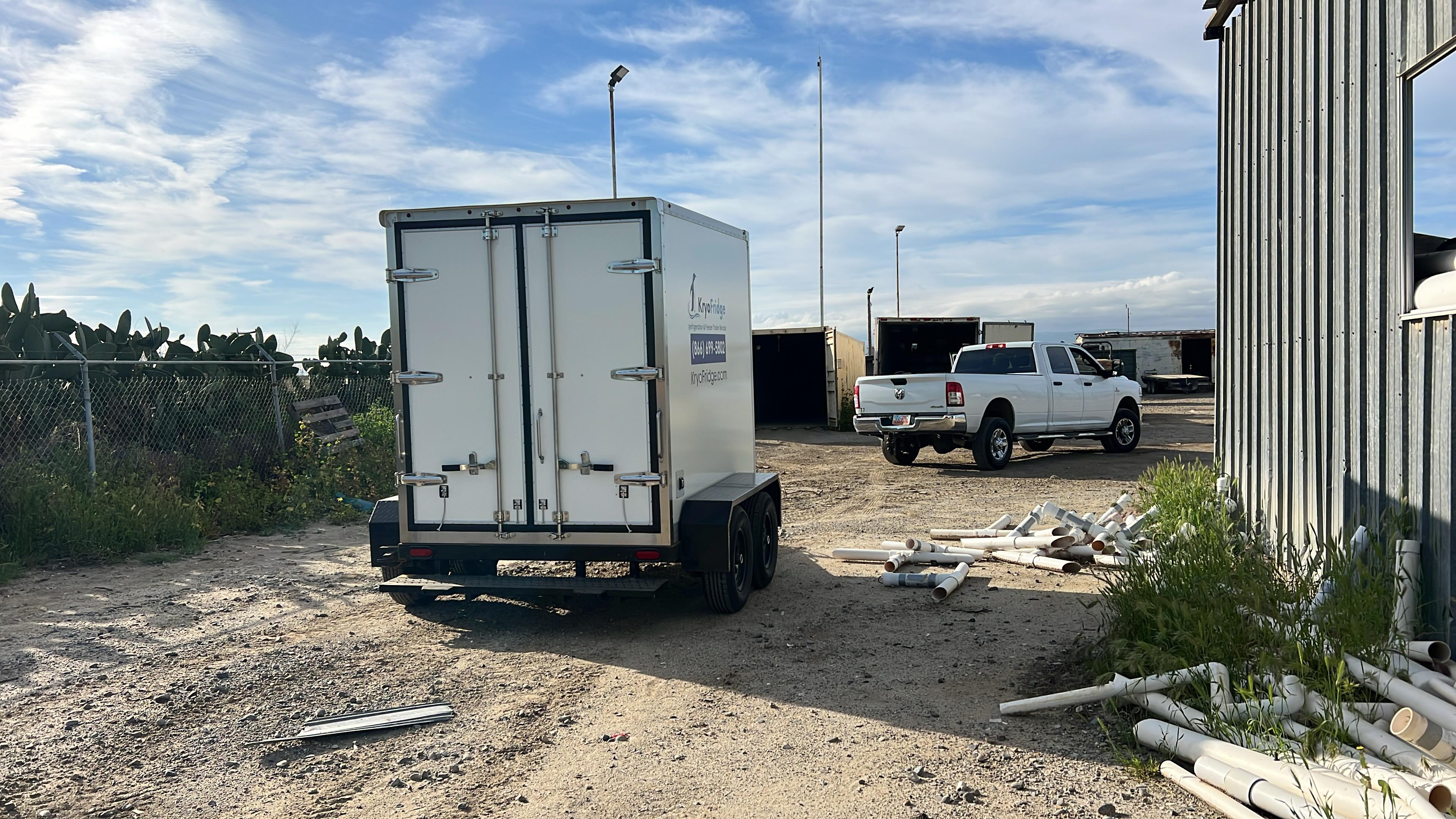 Clean white KryoFridge freezer trailer side profile staged for a Roseville cold-storage rental
