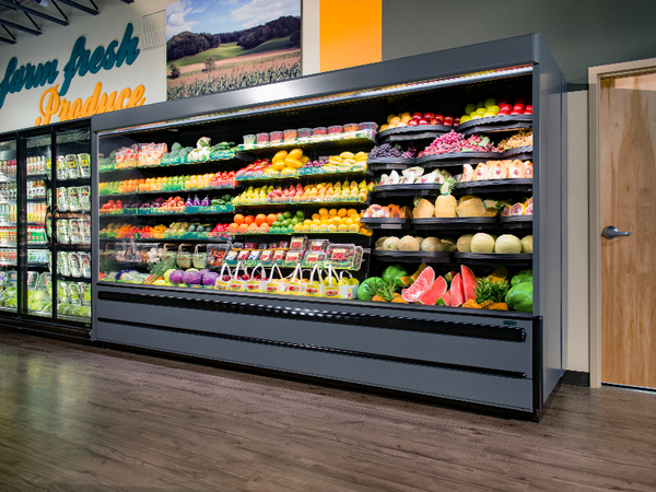 Stocked refrigerated grocery cases in a Santa Clarita market that rely on backup cold storage during an outage