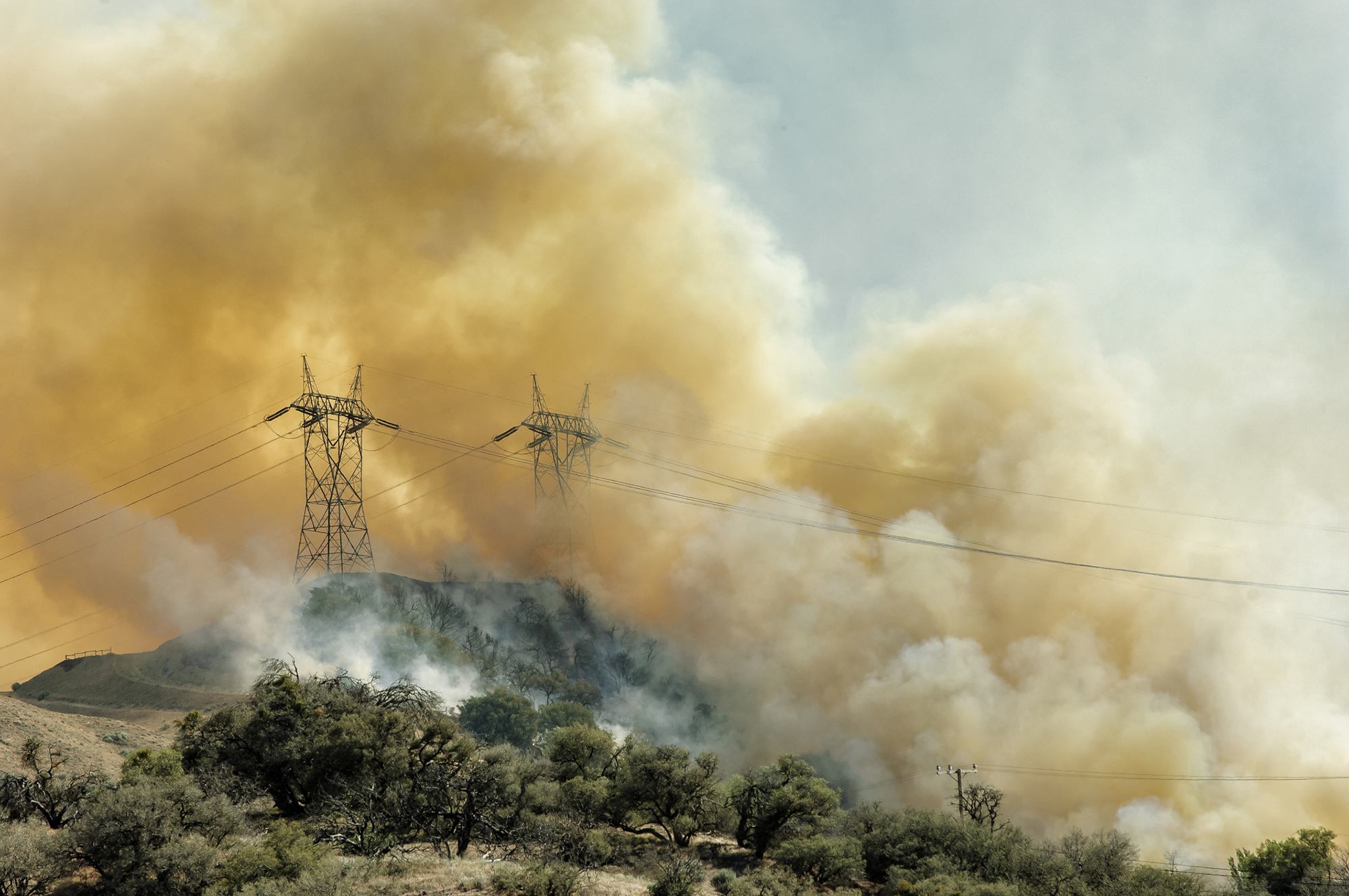 Wildfire smoke across transmission lines during a Santa Clarita Valley public safety power shutoff