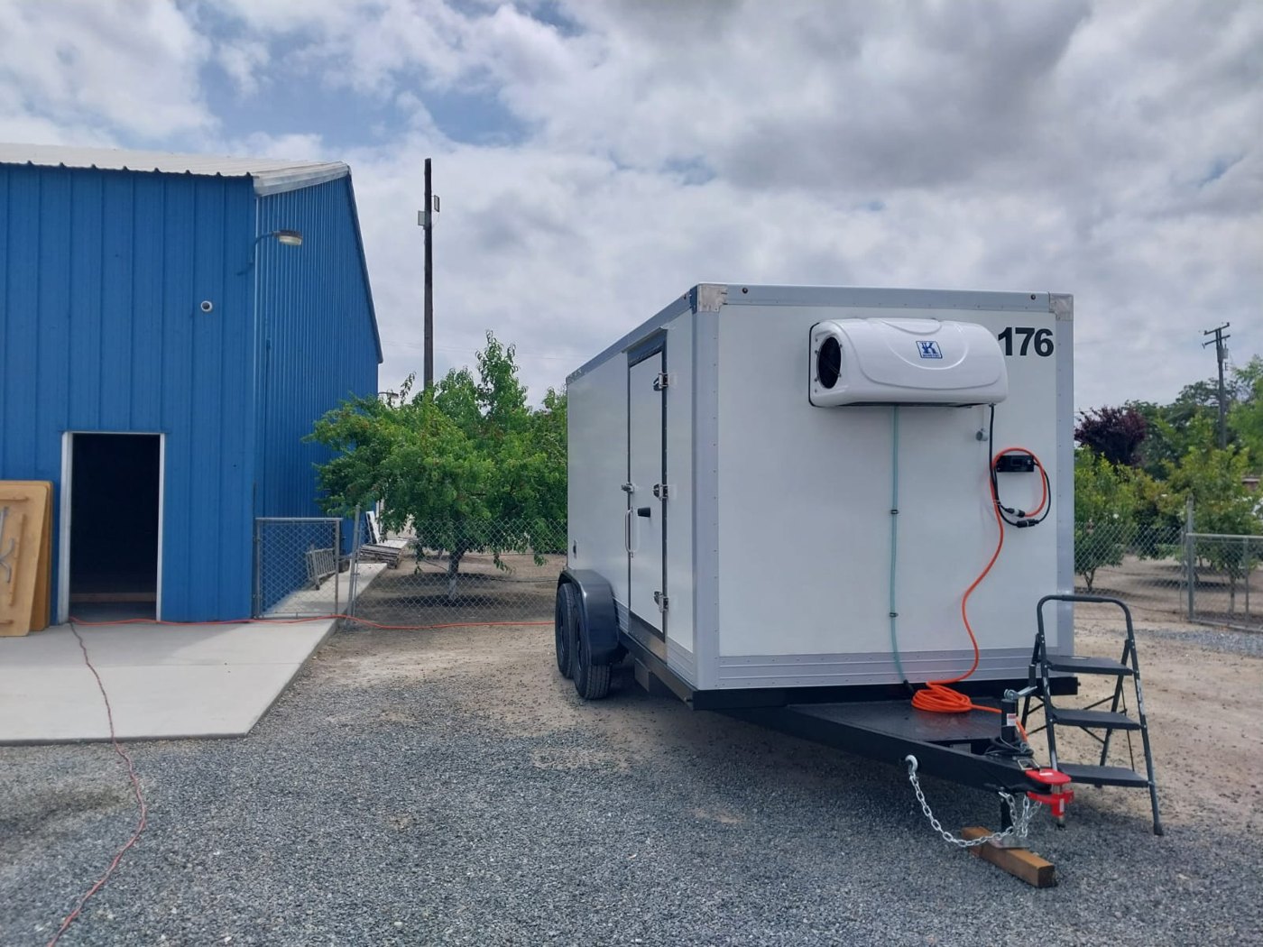 KryoFridge freezer trailer with its reefer refrigeration unit and power cord connected