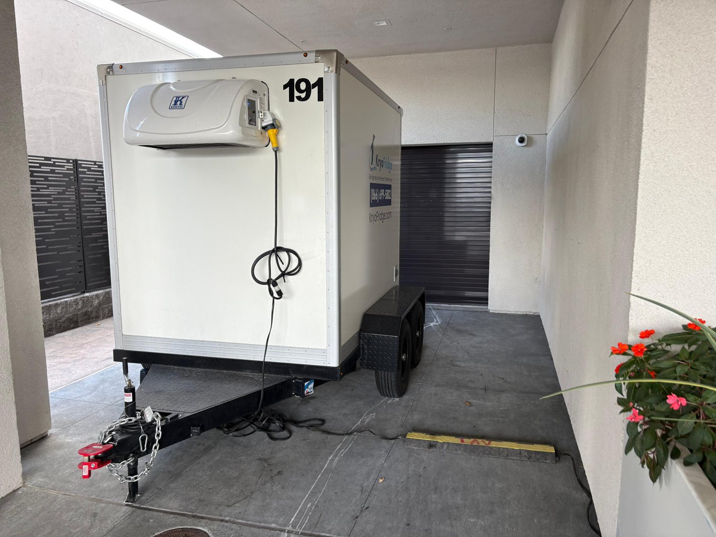 Close view of a KryoFridge trailer's refrigeration unit, which runs on a dedicated circuit or a generator