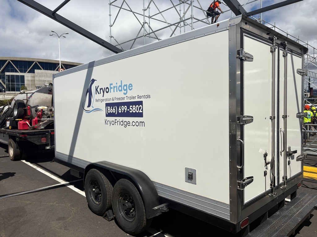 White KryoFridge refrigerated trailer staged on asphalt at a commercial lot