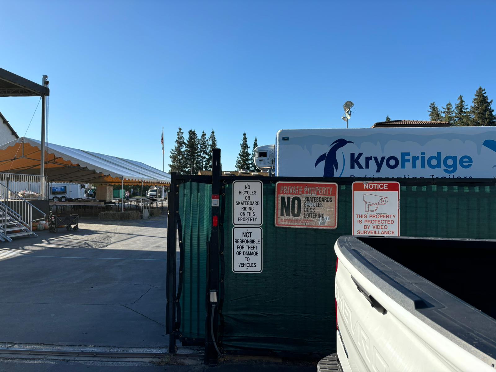 KryoFridge-branded refrigeration trailer with the penguin logo parked at a job site, the direct-operator fleet serving Albuquerque