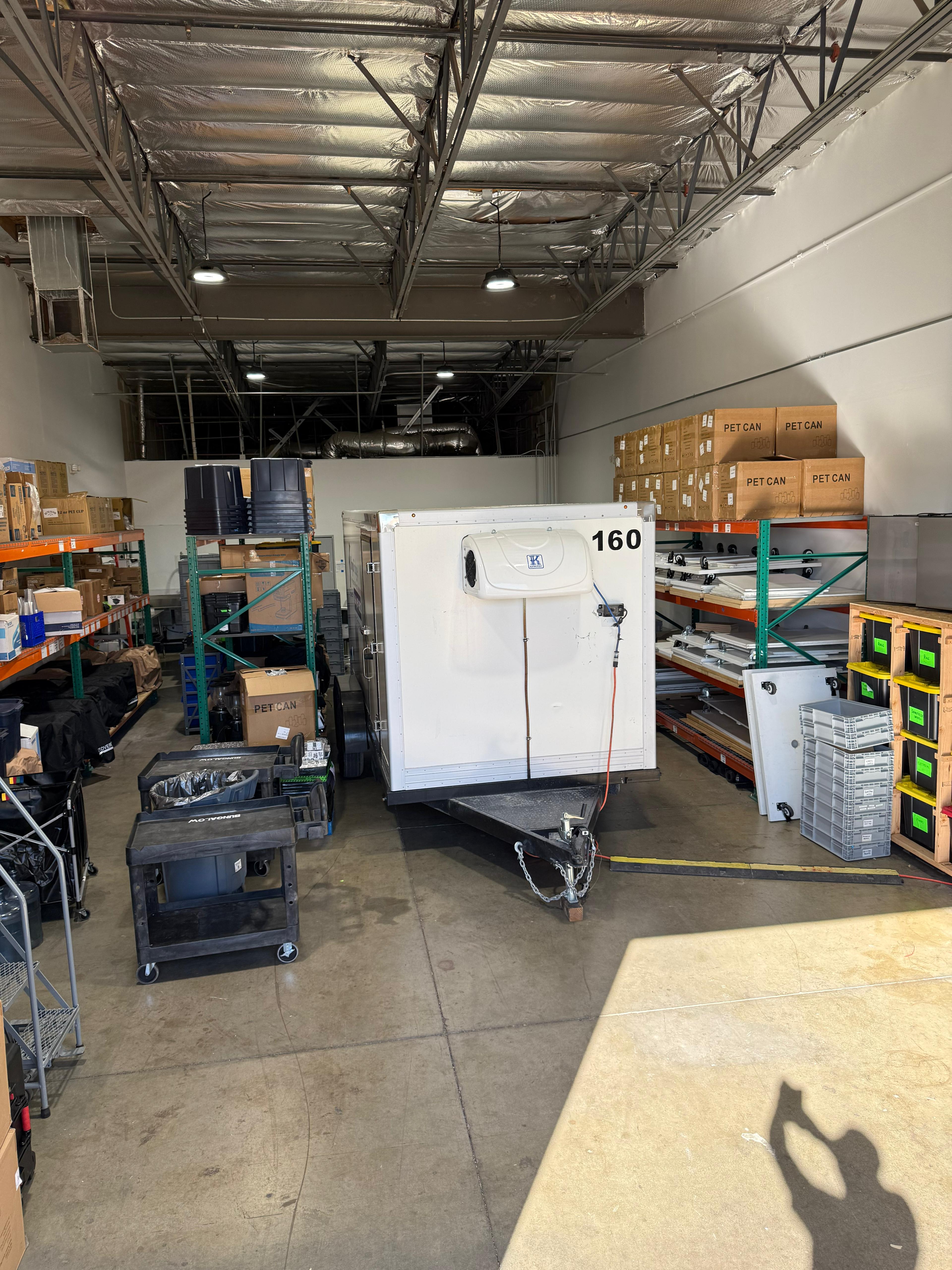 KryoFridge reefer trailer with its refrigeration condensing unit staged inside a facility