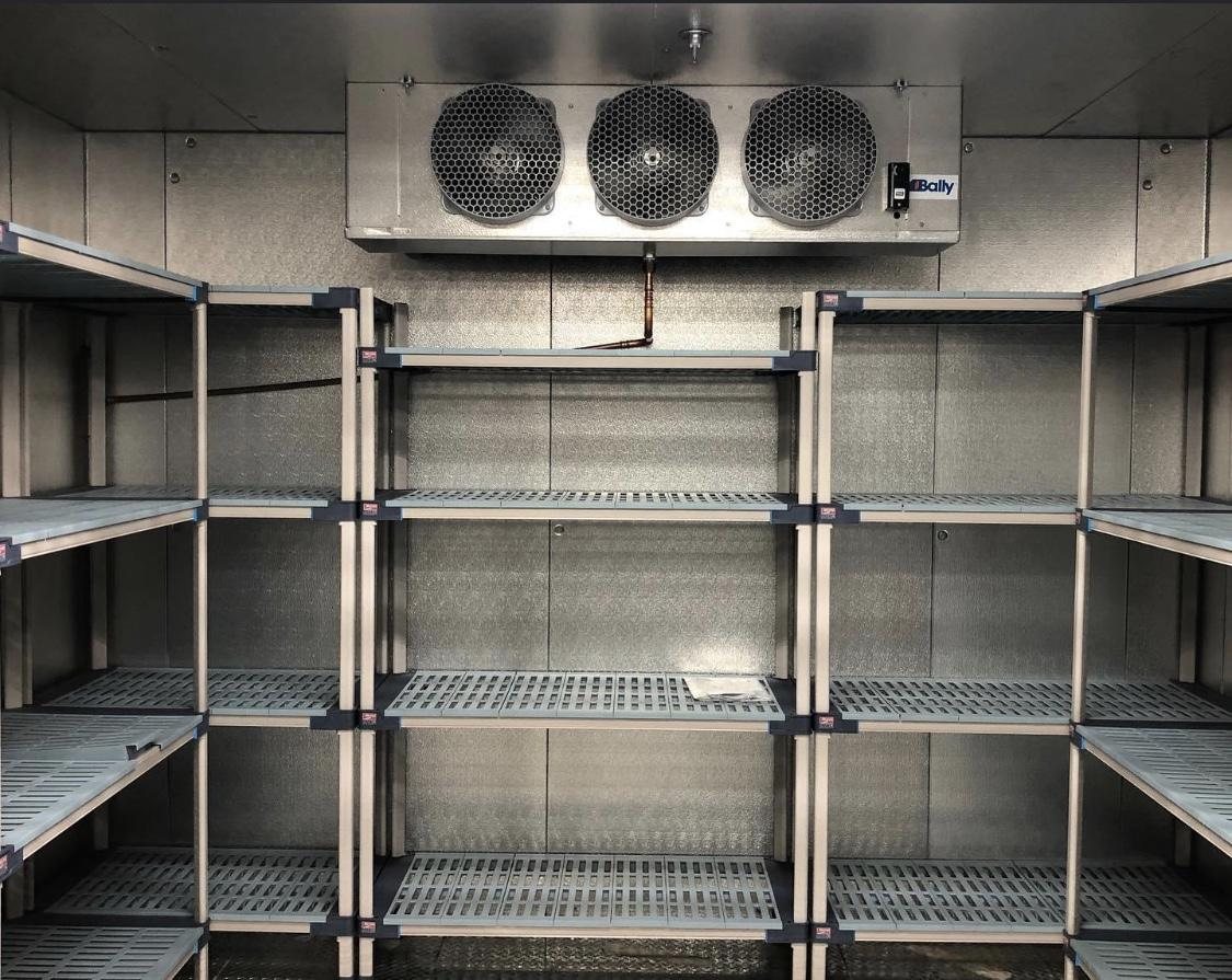 KryoFridge freezer trailer plugged in and holding temperature on a Salinas job site