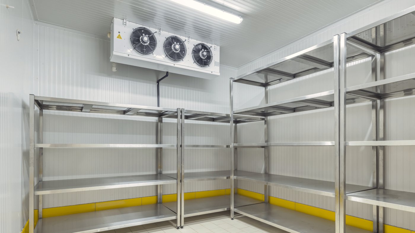 Stainless-steel walk-in cooler interior shelving inside a KryoFridge refrigerated trailer for Santa Ana cold storage