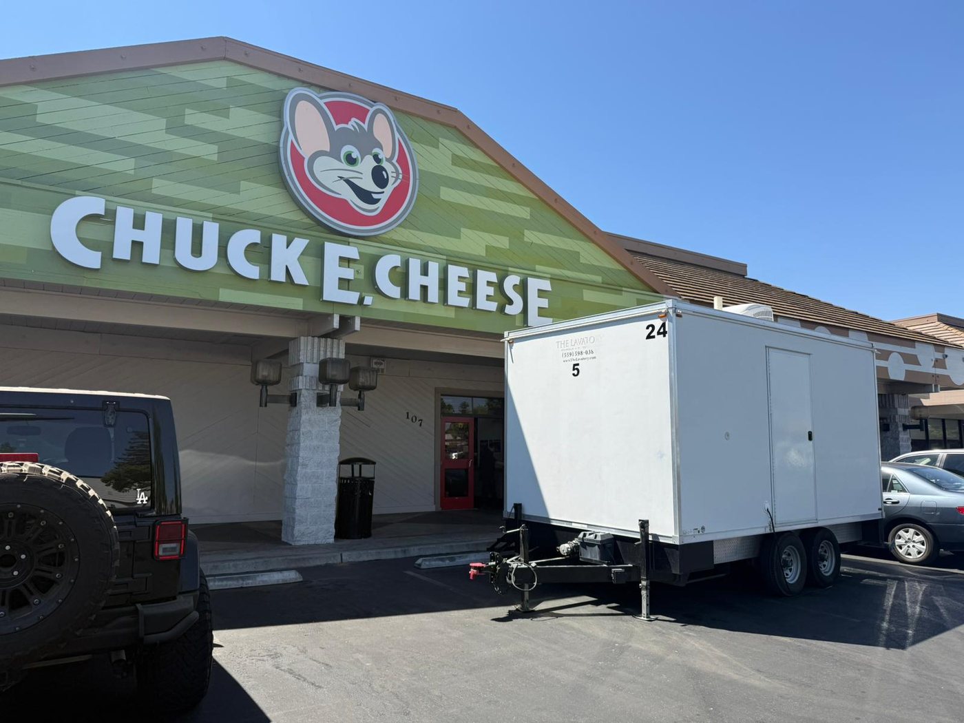 KryoFridge refrigerated trailer staged outside a Chuck E. Cheese entertainment venue providing temporary cold storage