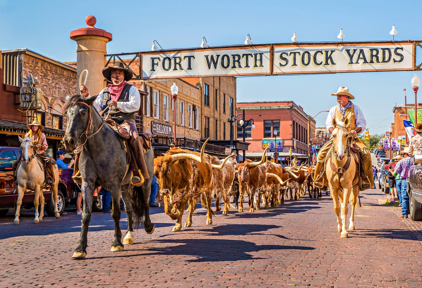 The Fort Worth Stockyards historic district with its iconic sign and cattle drive, part of the Dallas–Fort Worth service area
