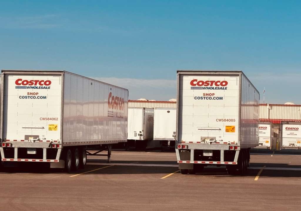 A lineup of KryoFridge refrigerated trailers staged together for a large-scale retail deployment