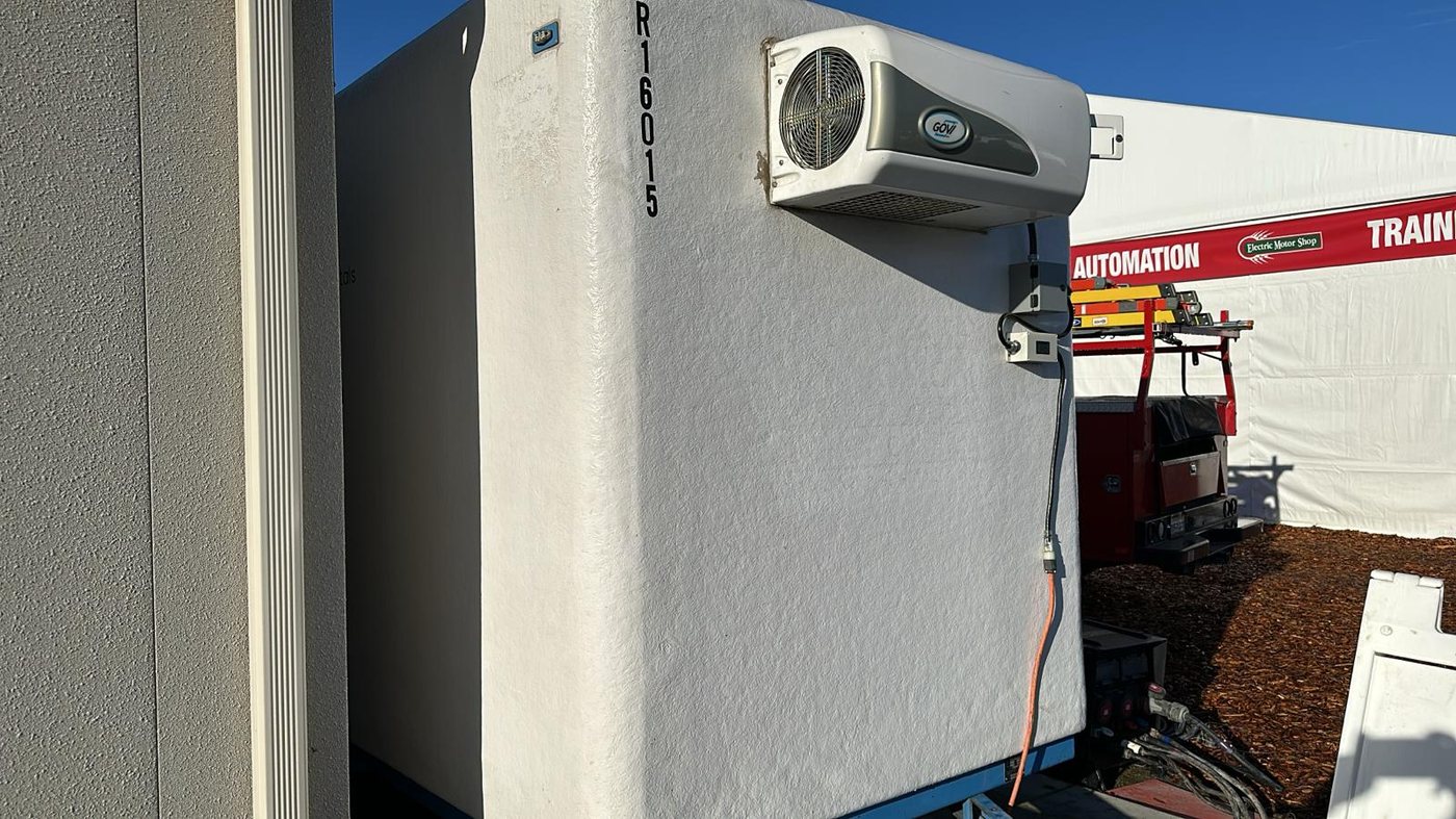 Close view of a KryoFridge trailer's refrigeration unit, which runs on a dedicated 120V circuit or a generator
