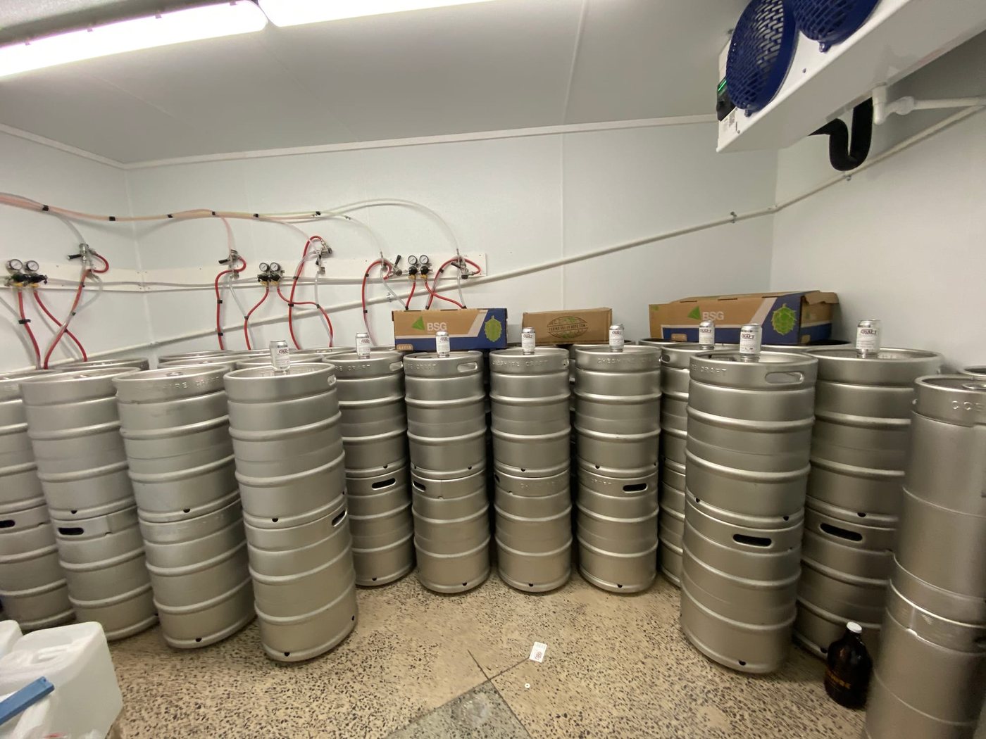 Kegs in a brewery cold room representing the beverage cold-storage needs of DFW independent breweries