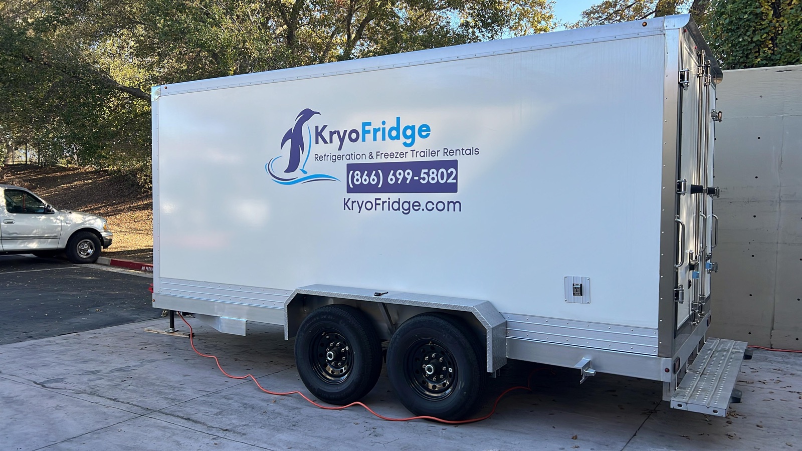 KryoFridge 16' Freezer Trailer parked at a restaurant back lot