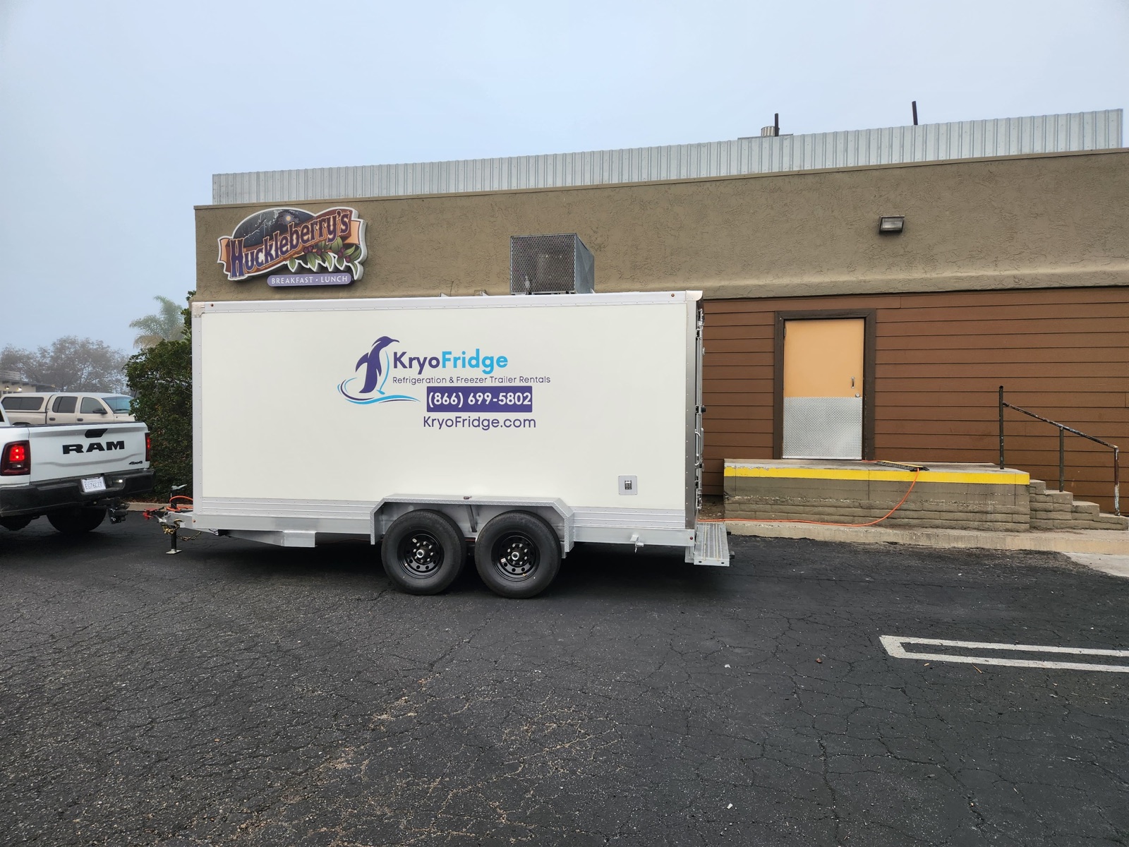 KryoFridge 16' Freezer Trailer parked at a restaurant back lot