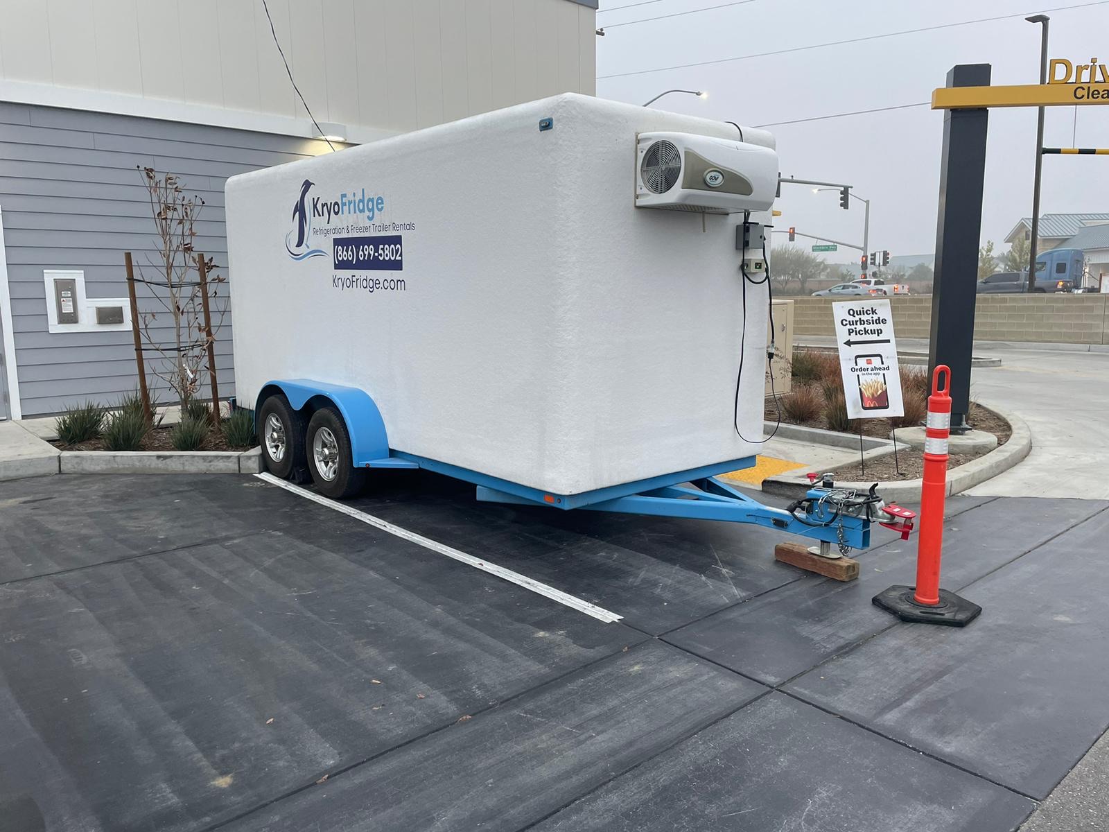 KryoFridge 8' Freezer Trailer parked at a restaurant back lot