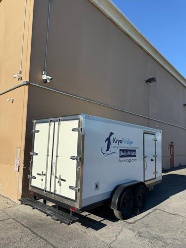 A white KryoFridge dual-purpose freezer and refrigerated trailer supporting Pantries and relief kitchens in Redding
