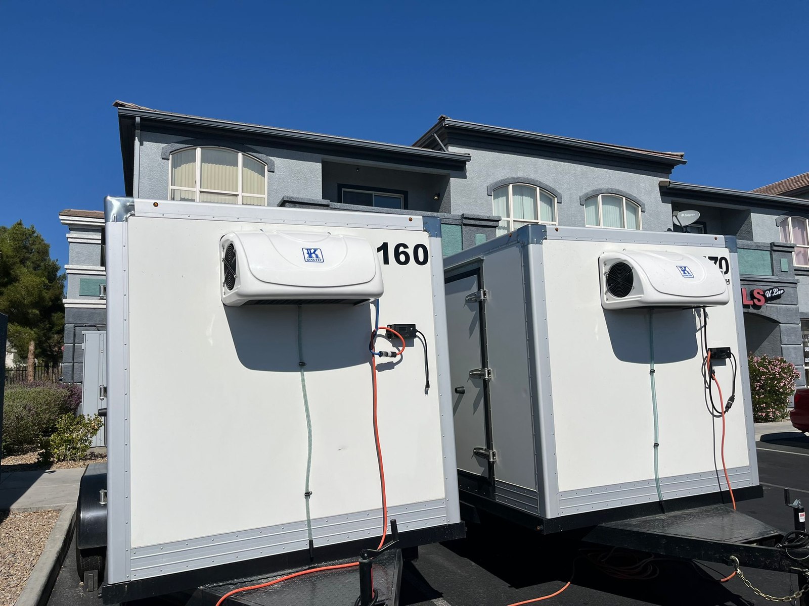 A plugged-in KryoFridge cold chain trailer on generator power in Killeen